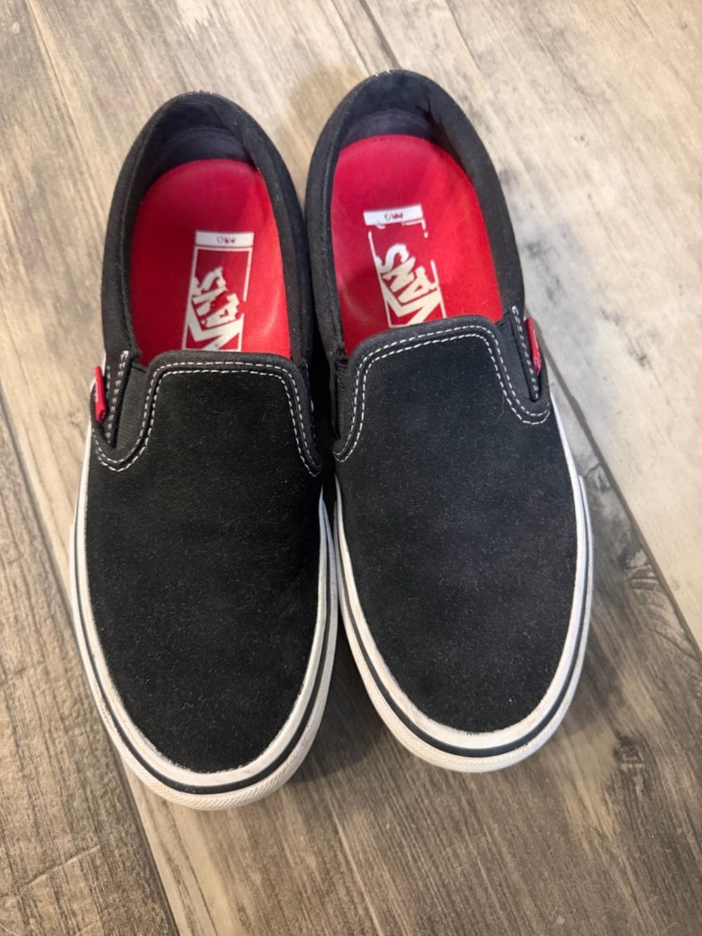 Vans Black Slip-On Sneakers with Red Insole